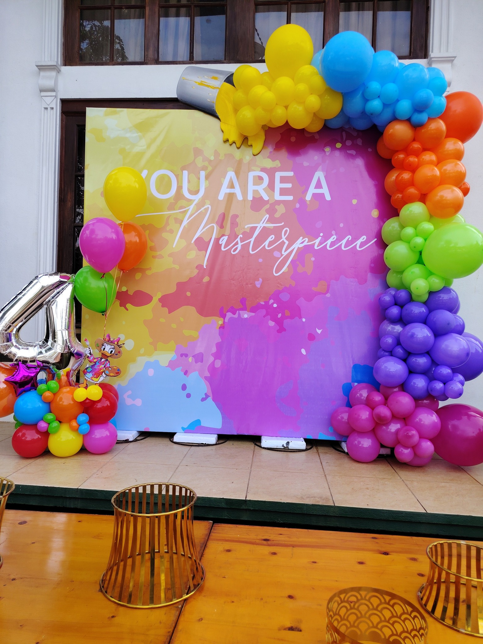 Birthday party backdrop with custom balloon arrangement