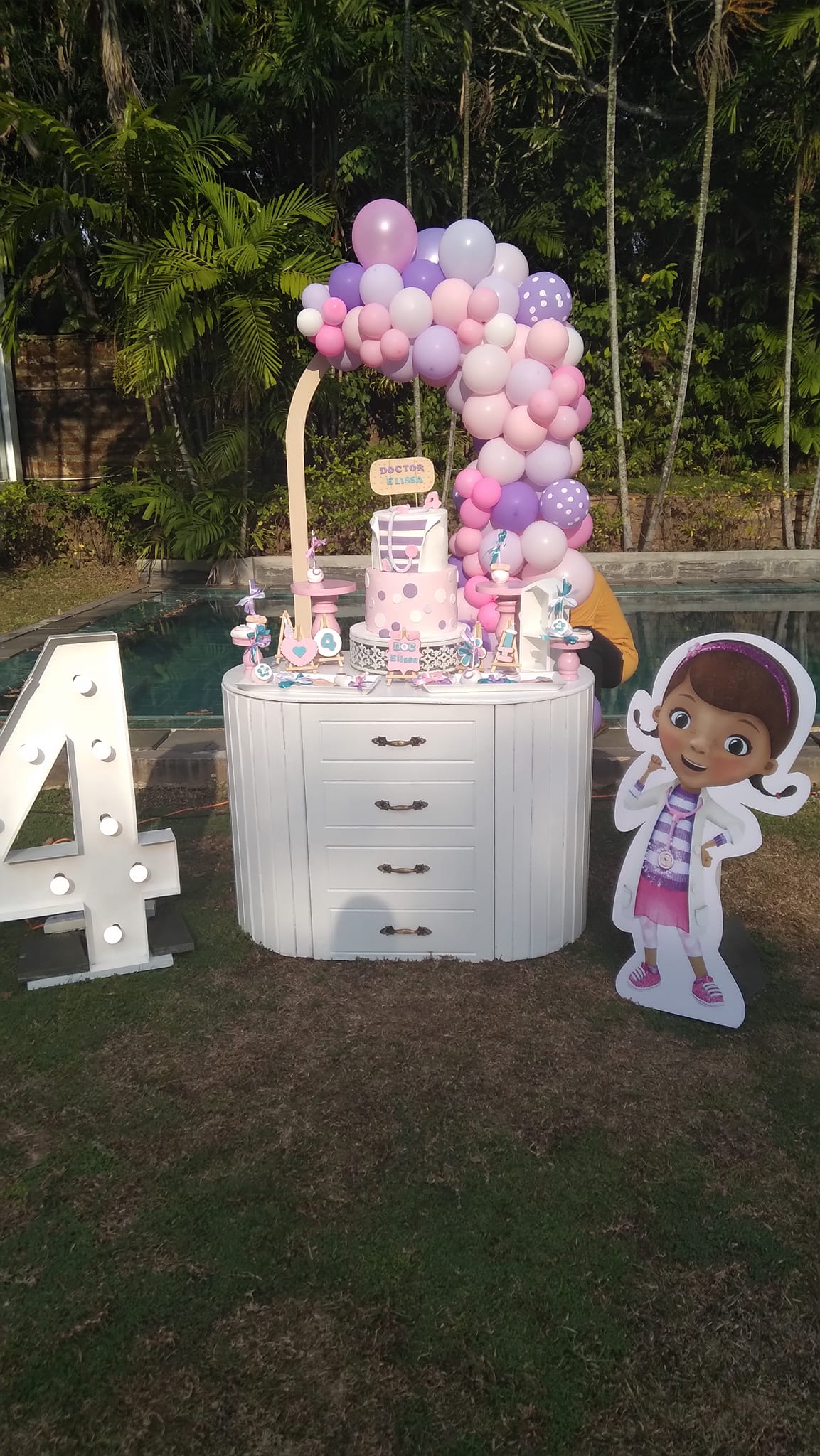 4th birthday balloon setup with themed decorations