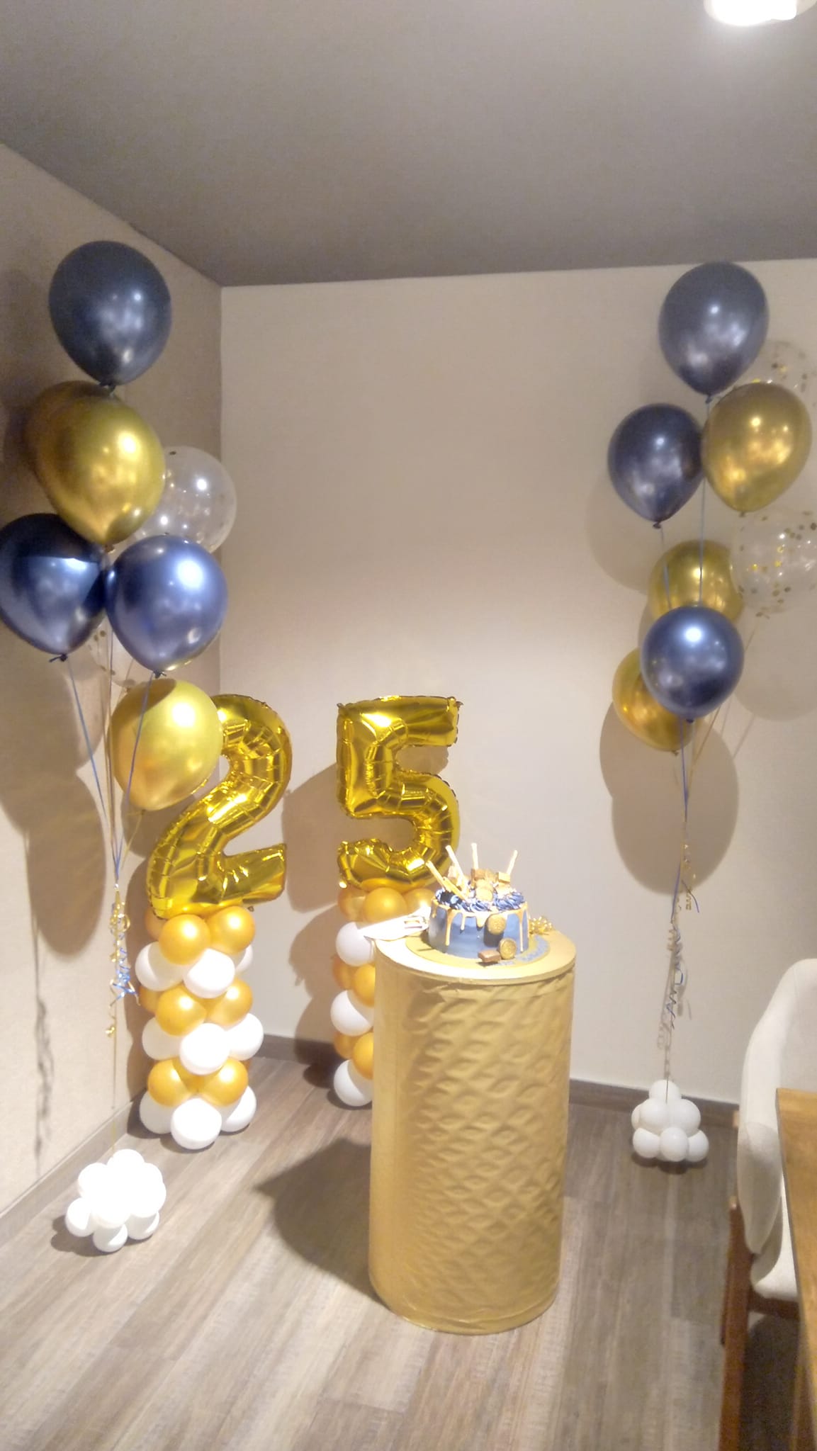 25th birthday party decoration with balloons and backdrop setup